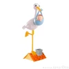 Figura cigüeña con bebé niño - Dekora