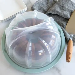 Portatartas transparente con base azul Bundt - Nordic Ware