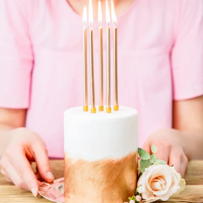 Velas largas doradas (12) - PartyDeco